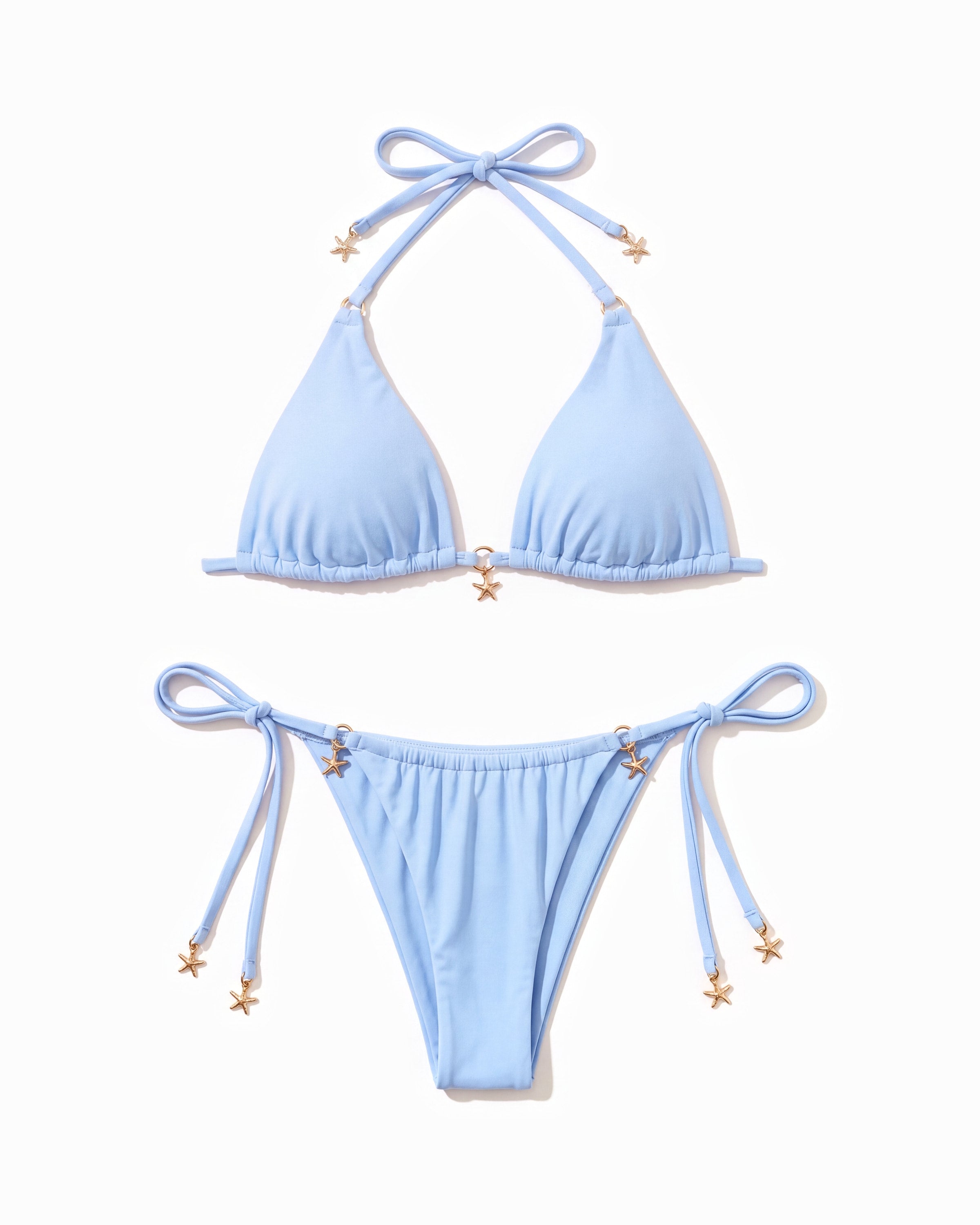 Lacey Set laid flat, with its gold starfish charms